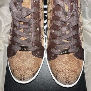 Coach Tennis Shoes in perfect condition. No signs of wear & tear.